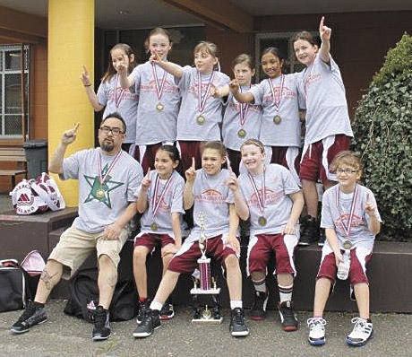 The Mercer Island girls select fourth-grade basketball team recently won the Rotary Winter Championships.