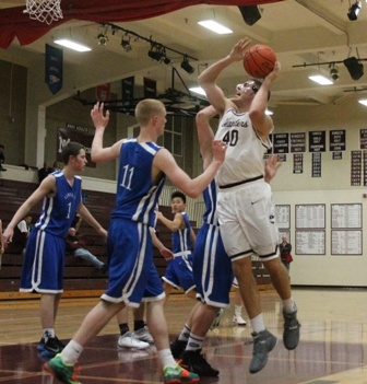 Mercer Island's Andrew Pickles (40) fights for his shot in the post against Liberty Tuesday