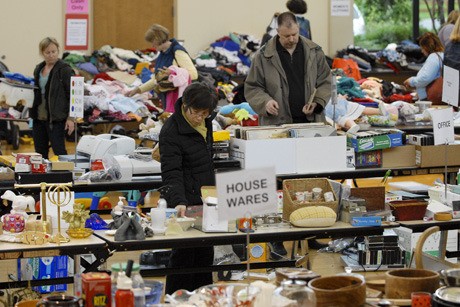 Shoppers peruse the goods at the Mercer Island Presbyterian Church rummage sale last Friday evening.