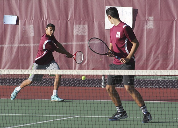 Christian Anderson returns a serve during his doubles match with teammate Rafa Gonzalez-Posada against Bellevue Oct. 16.