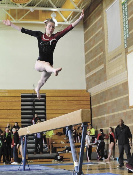 Mercer Island gymnast Emily LIghtfoot competes in the beam competition during the 3A KingCo meet on Saturday