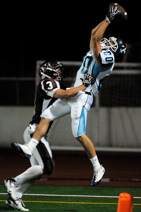 Saints WR Bobby Mueller (80) makes a catch for a two-point conversion over Islanders DB Ben Emanuels (3) at Mercer Island on Friday. Interlake won a 51-45 shootout at Islander Stadium.