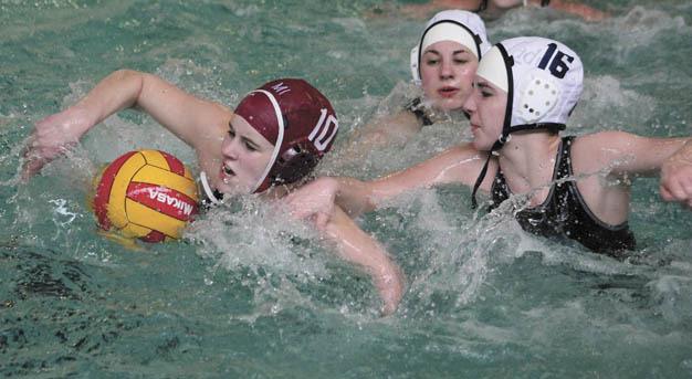 Kristin Hoffman swims with the ball during the Mercer Island girls water polo home game against the Spartans on Wednesday