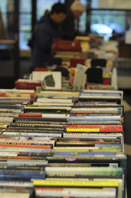 Readers browse through books at the Mercer Island library during the annual spring book sale.