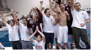 Islander teammates cheer a new overall state record set by the Mercer Island 400-yard freestyle relay team in the final race of the boys 3A state swimming championship at the King County Aquatic Center in Federal Way on Saturday.