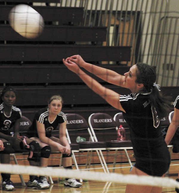 Mercer Island captain Emma Guthrie passes the ball over the net during game three of the Islanders win over Sammamish on Wednesday night. The team is undefeated in league play.