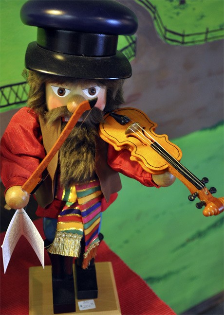 A bearded fiddler is among the annual holiday display of nutcrackers at the Alpenland restaurant in the Town Center. The nutcrackers are for sale.