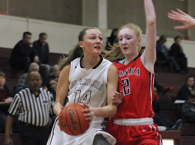 Mercer Island's Jess Blakeslee (14) looks to shoot against Juanita's Brittany White (2) Wednesday