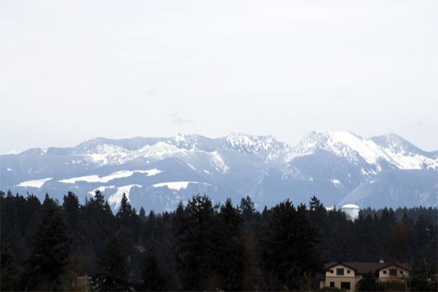 The Cascade mountains glimmer with new snowfall in late March