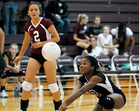 Islander freshman Lorial Yeadon (3) digs a ball as teammate Alisa Owens (2) looks on against Interlake at Mercer Island on Tuesday. The Islanders beat Interlake in straight games -- 25-10