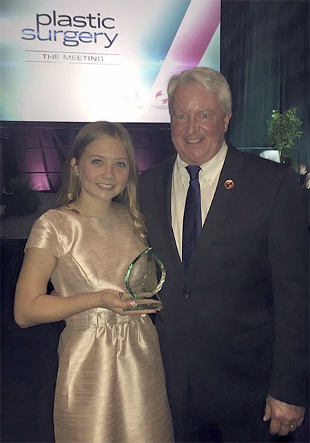 Lily James and Dr. Nicholas Vedder smile after James received her award as a Patient of Courage.