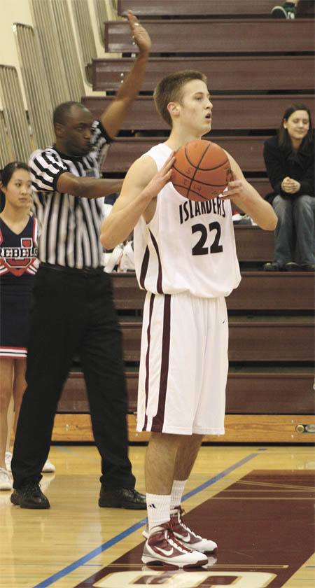 Junior Quinn Sterling looks for an open teammate during the second half of the Islanders home win over Juanita last Tuesday. Sterling was responsible for 13 points in the 57-44 win.