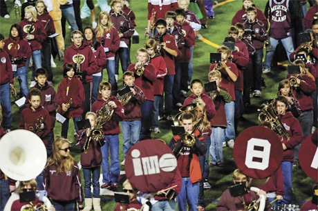 Members of the Islander Middle School band perform as a part of All Island Band Night during halftime at Friday’s football game against Juanita High School at Islander Stadium. Hundreds of students from fifth grade through high school marched and played together in what has become a long-standing Island tradition.