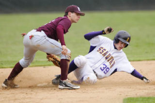 Second baseman Joey Scalzo puts down the tag on a runner during the Islanders’ loss to Issaquah on May 6 at Bannerwood Stadium.