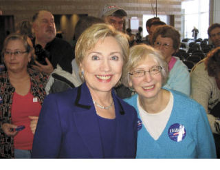 Islander and Chair of the 41st District Democrats Barbara Geller stands with Hillary Clinton.