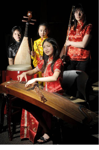 Chinese Arts & Music Association members pose with their instruments: from left