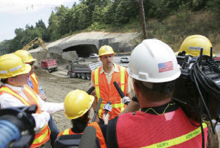 Washington State Department of Transportation Construction Engineering Manager Brian Nielson speaks to the media in front of the Wilburton Tunnel on I-405 just before the I-90 interchange in Bellevue on July 21.