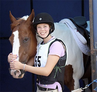 MIHS sophomore Kat Tiscornia poses with her horse