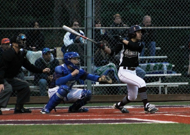 Mercer Island’s Noah Hsue swings for a 2-RBI triple against the Liberty Patriots Friday at Island Crest Park. Hsue’s sixth-inning hit helped the Islanders rally back from a five-run deficit as Mercer Island beat Liberty 6-5 (Joe Livarchik/staff photo).