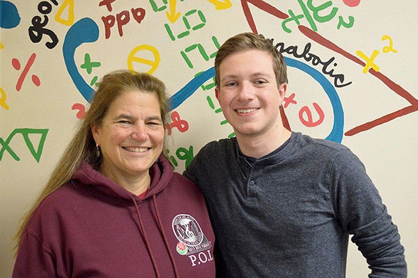 Mercer Island High School teacher Kim Schjelderup poses with senior Adam Tucker