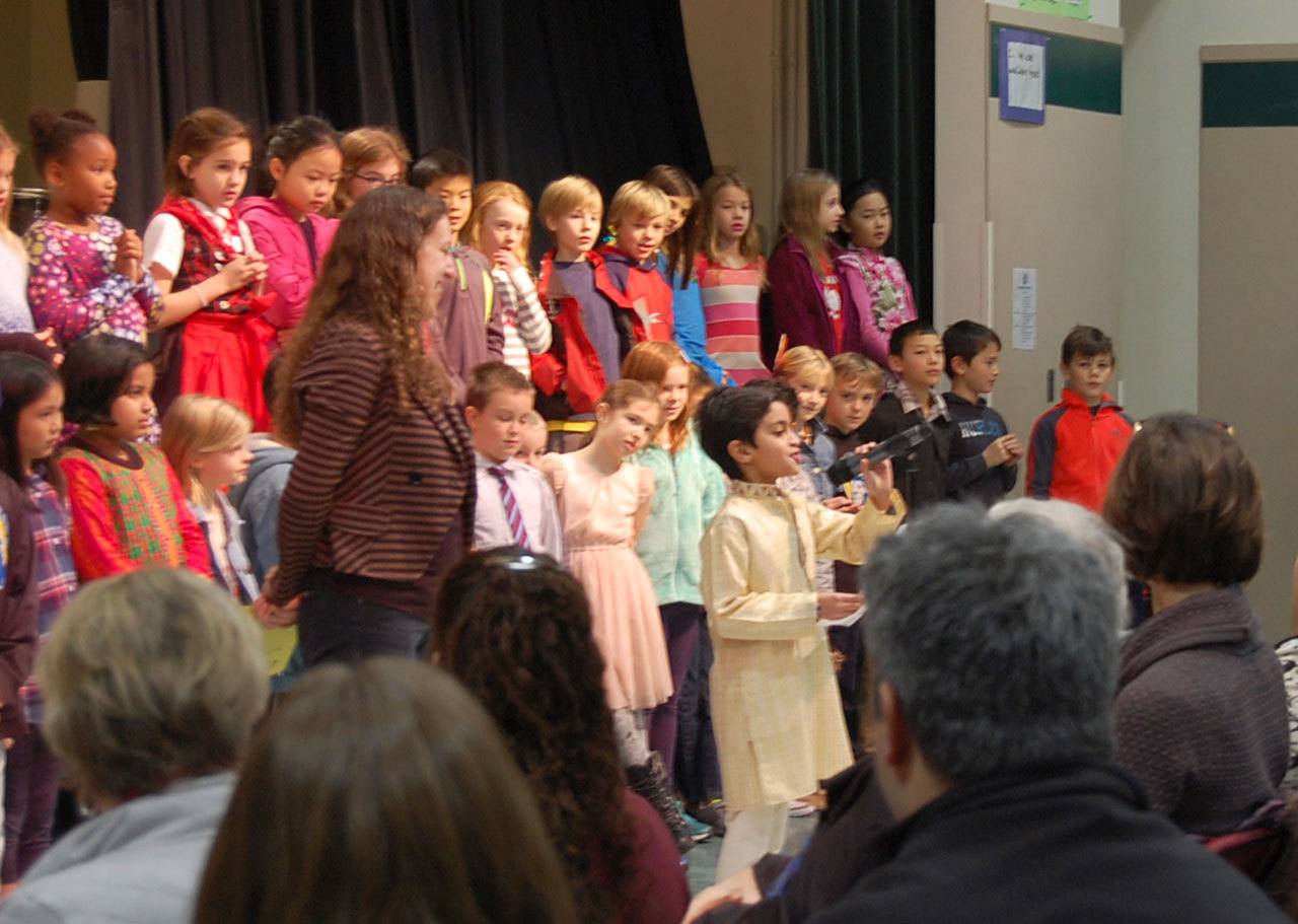 Third graders sing a welcome song to friends and family at the Lakeridge culture fair on Dec. 14. Katie Metzger/staff photo