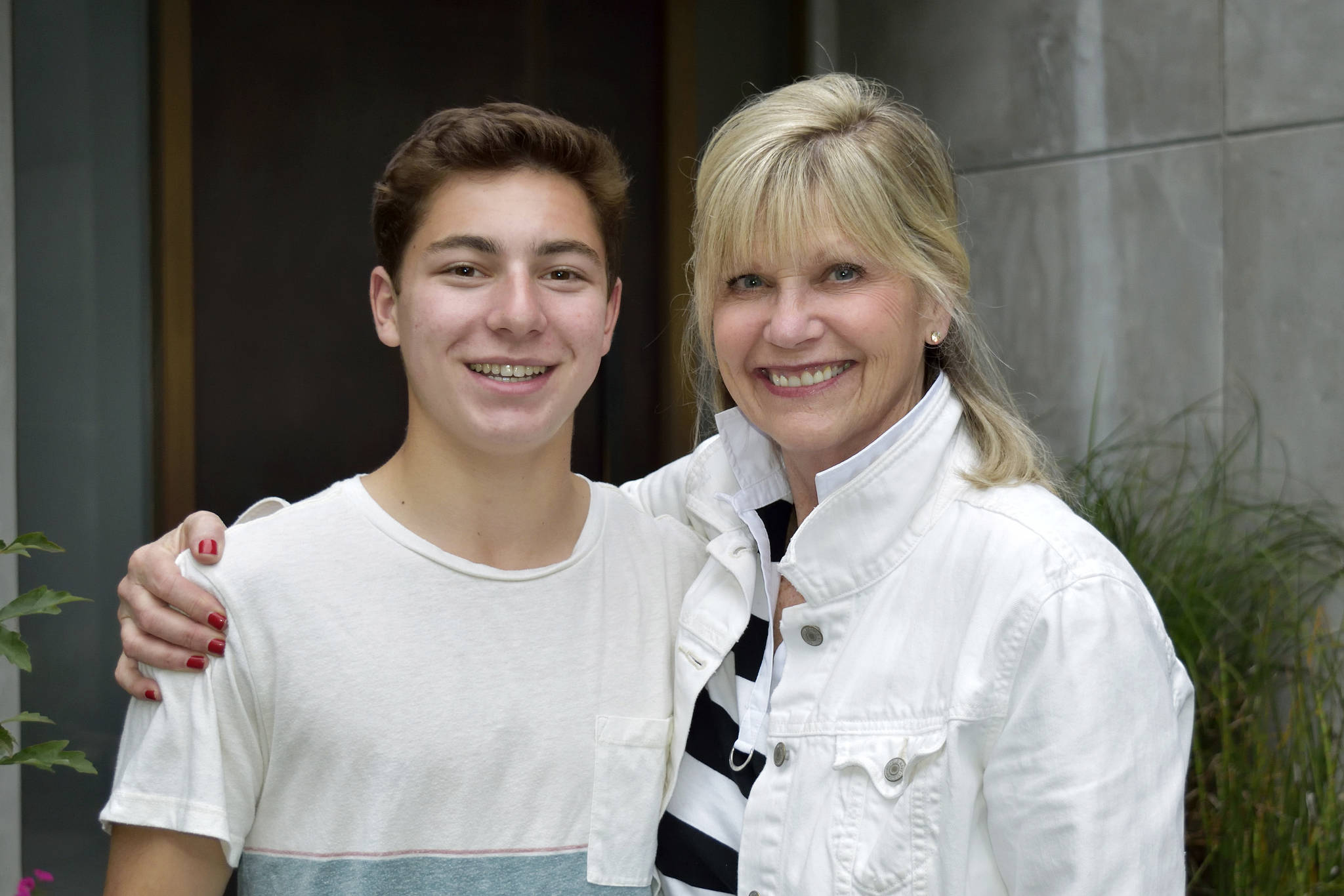 Judy Tassone (Steve Newman’s sister), right, congratulates Mitchell Meade, left, after he was the recipient of the Steve Newman Spirit Award. Photo courtesy of Nancy and Stephen Meade