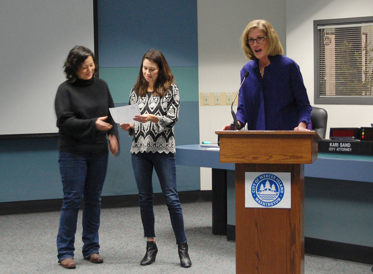 Newly selected Mayor Debbie Bertlin proclaims Jan. 15 as Martin Luther King Jr. Day at Tuesday’s Mercer Island City Council meeting. Representatives from Mercer Island Democracy in Action and One MI, Jennifer Guerrero Flood and Robin Li, accepted the proclamation. Katie Metzger/staff photo