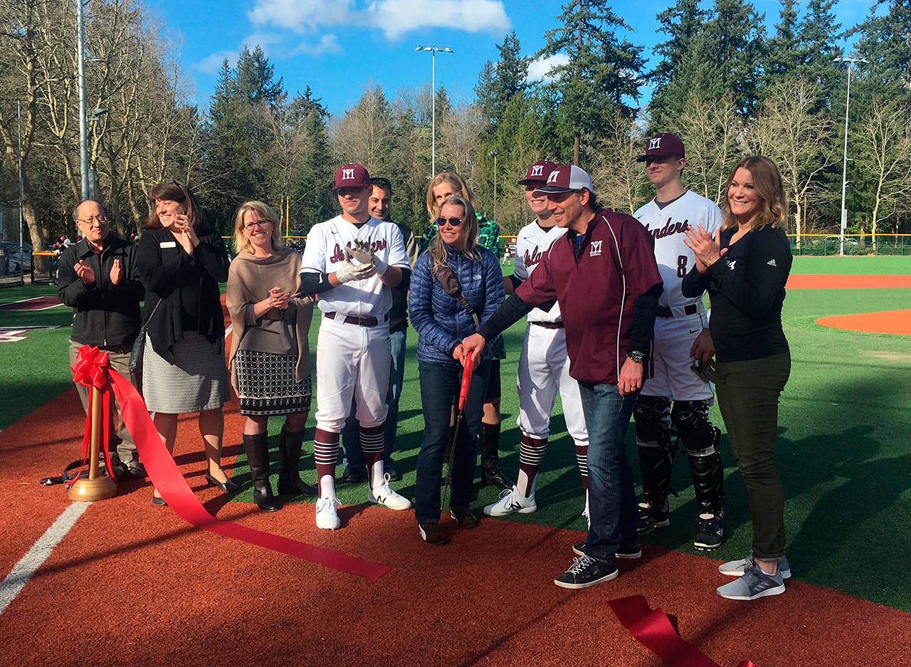 Mercer Island baseball players, boosters and elected officials cut the ribbon on the north field of Island Crest Park before the first varsity home game on March 14. Katie Metzger/staff photo