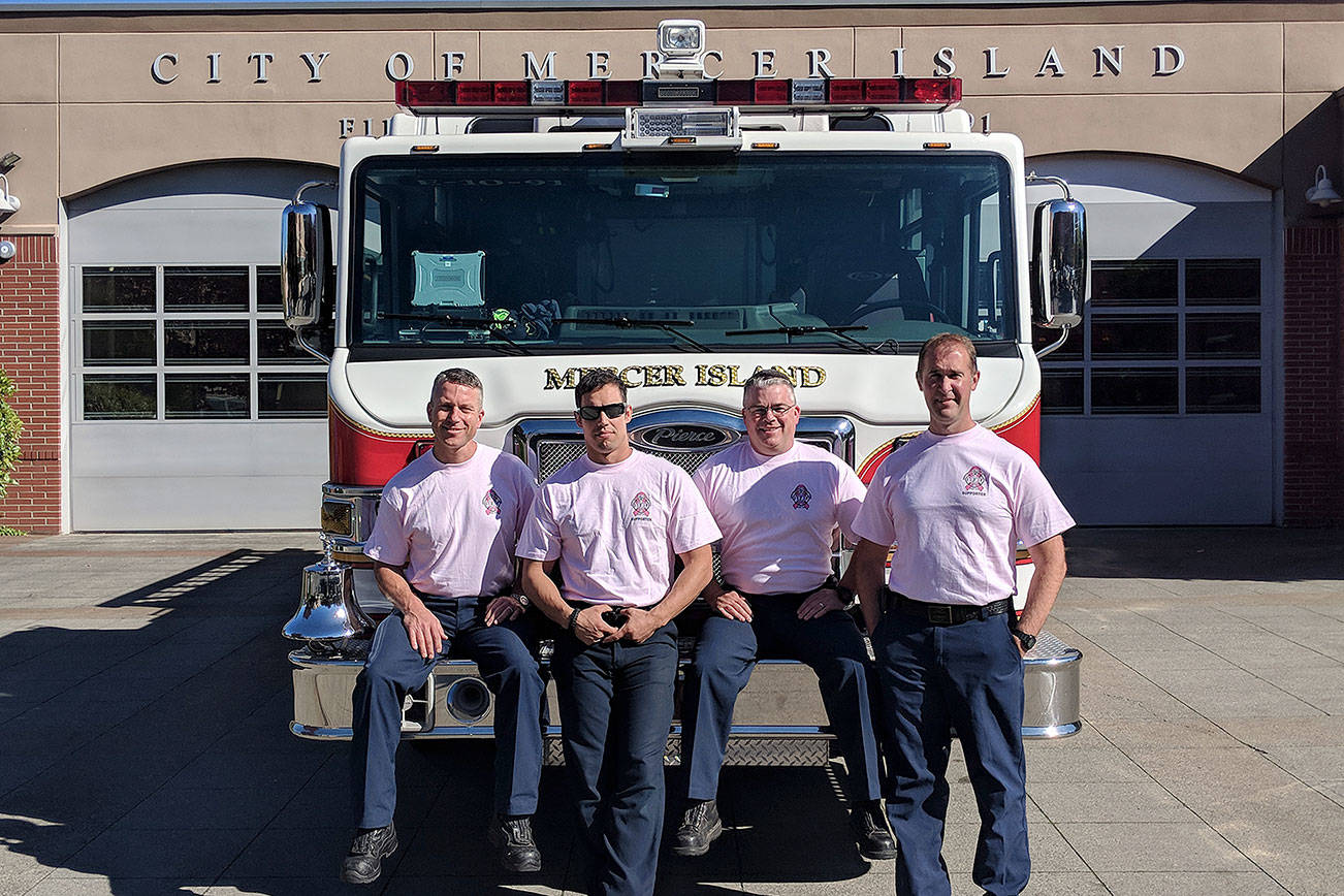 (From left) Mercer Island firefighters Lt. Ray Austin, Dan Jackson, Alec Munro and Lt. Steve McCoy pose for a picture in their pastel pink breast cancer awareness shirts. Photo courtesy of Ray Austin