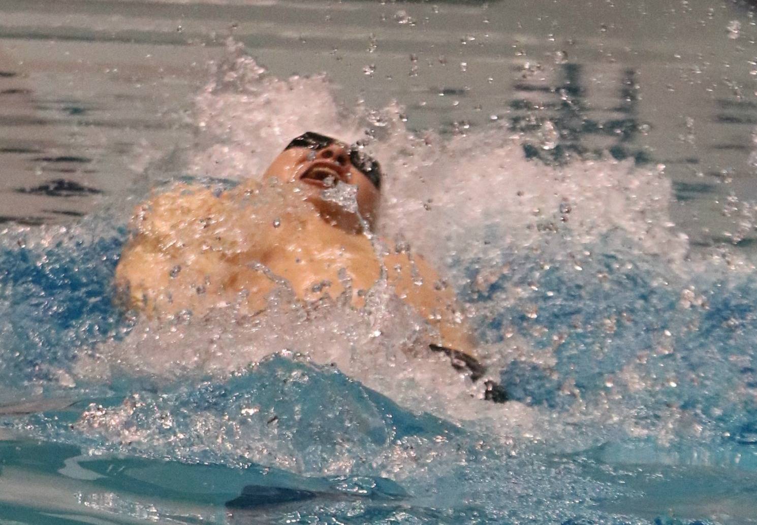 Mercer Island’s James Richardson plows through the 100 backstroke on his way to victory. Andy Nystrom / staff photo