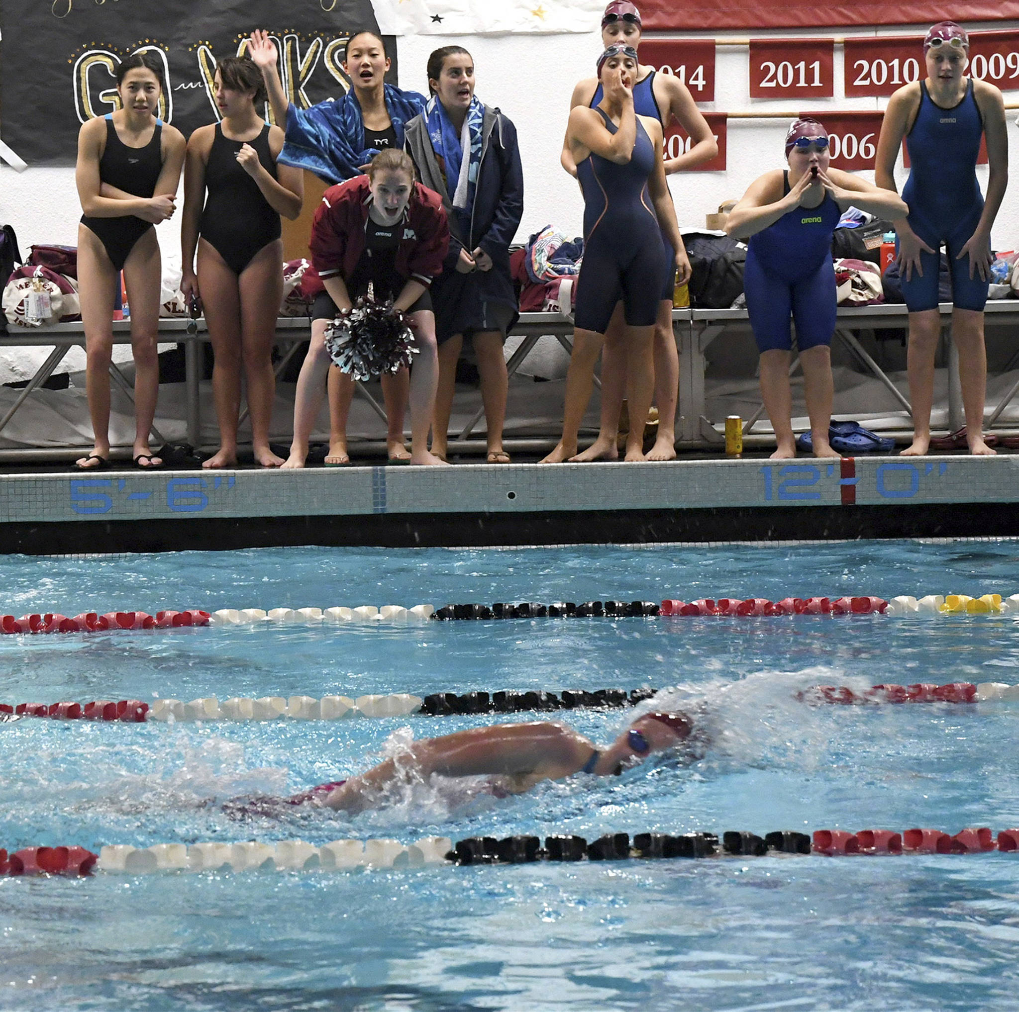 Mercer Island swimmer Cayla Prophater competes in the 200 free while being cheered on by teammates at the district meet on Nov. 9. Photo courtesy of Allison Nelson