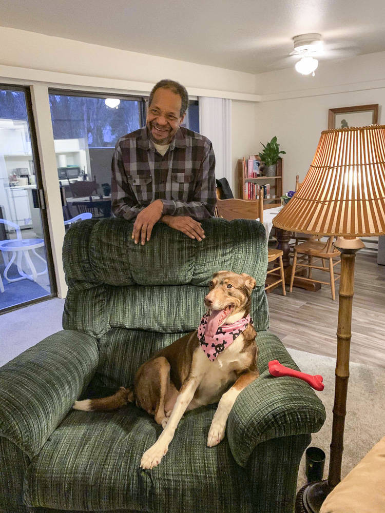 Alan Roach and his dog, Roxie, reunited in their new apartment. Natalie DeFord/staff photo