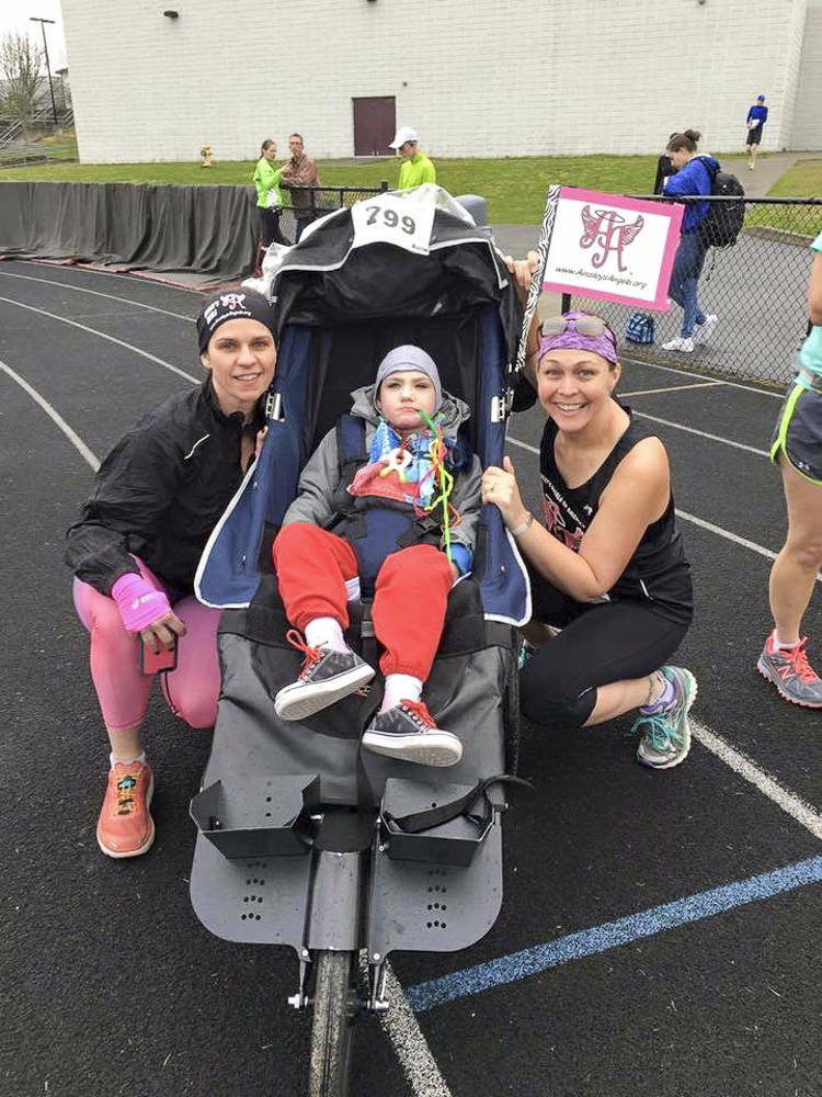 Courtesy photo                                From left, Sarah Poppe, James Mattson and April Shrum participating at a previous race event as part of nonprofit Ainsley’s Angels.