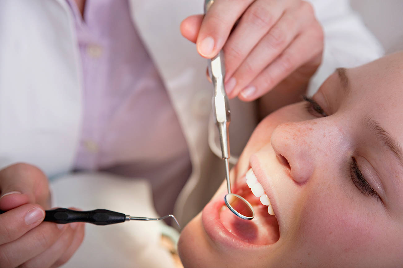 Dentist checking patient’s teeth. Sound Publishing file photo