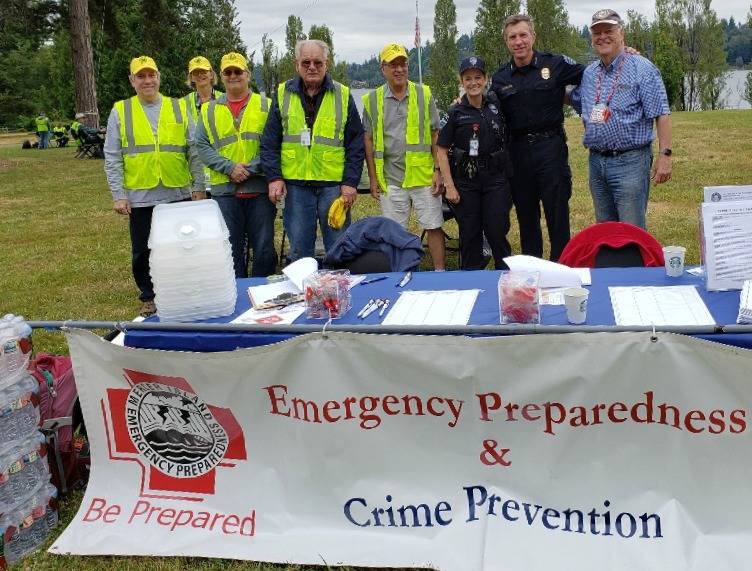 From Left to right at Mercer Island Emergency Preparedness Day on June 22, 2019 at Luther Burbank Park: Dallas Jolley, Pat Hackett, Jeff Peterson, Charles Johnson, Benson Wong (then city councilmember, now mayor), Mercer Island Police Department officer Jennifer Franklin (the police department’s emergency preparedness officer), police commander Dave Jokinen and Woody Howse. Photo courtesy of the Mercer Island Radio Operators