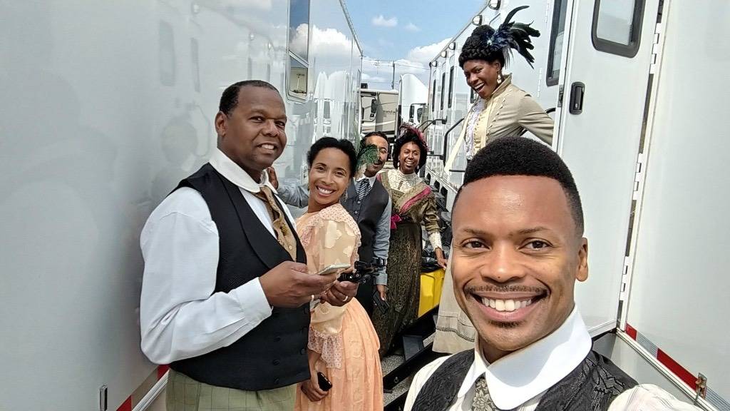 Safiya Ricketts, in the peach dress on the left, gathers with her fellow performers on the set of “Self Made.” Courtesy photo