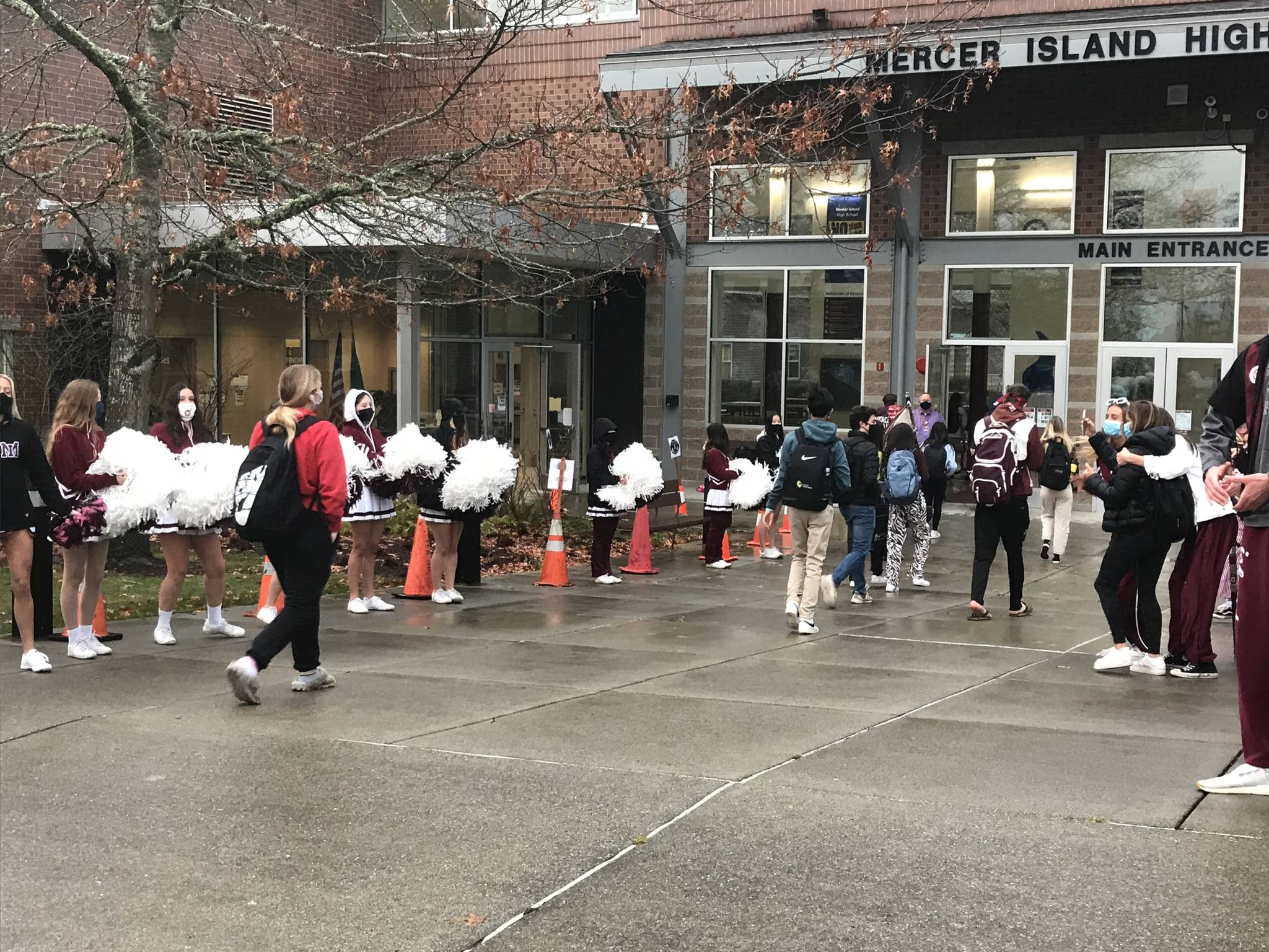 Cheerleaders line the walkway as students in the “A” cohort at Mercer Island High School returned to classes on March 22 for two days of hybrid learning, with the “B” cohort coming to school on March 25. Photo courtesy of the Mercer Island School District