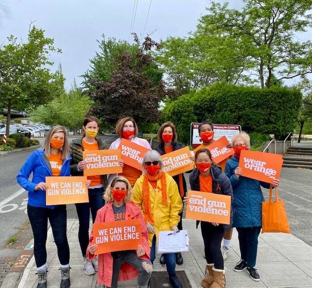 A group of Mercer Island PTA and community members joined some Moms Demand Action members from the greater Seattle area at the Farmer’s Market on Sunday to distribute orange ribbon pins to honor victims and survivors of gun violence. Photo courtesy of Lori Cohen-Sanford