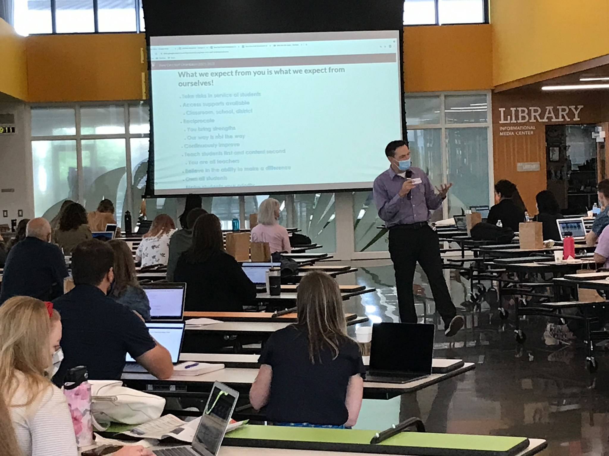 Deputy Superintendent Dr. Fred Rundle addressed the Mercer Island School District’s 38 new staff members on Aug. 23 as they began two days of orientation in the Northwood Elementary commons. Photo courtesy of the Mercer Island School District