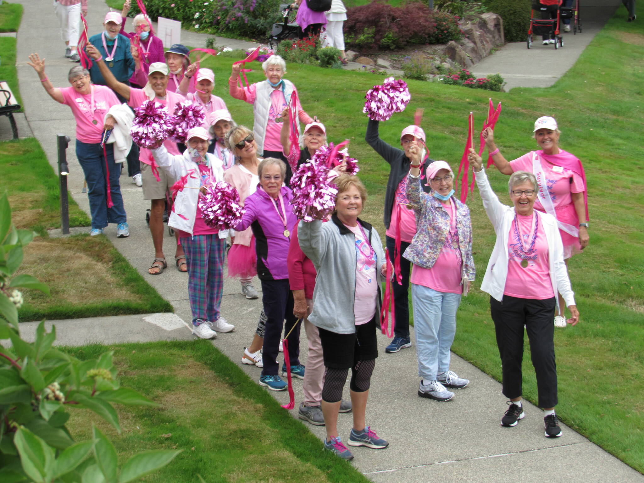 Residents and employees at Covenant Living at the Shores on Mercer Island recently held its seventh annual Making Strides Against Breast Cancer event with two days of activities, including a survivors wave (pictured), rally and campus walk. This event precedes the October annual campaign for Breast Cancer Awareness month with the American Cancer Society. More than 120 residents and employees have raised more than $4,300 at press time. Since its inception, those at Covenant Living have raised more than $20,000 for the cause. Courtesy photo