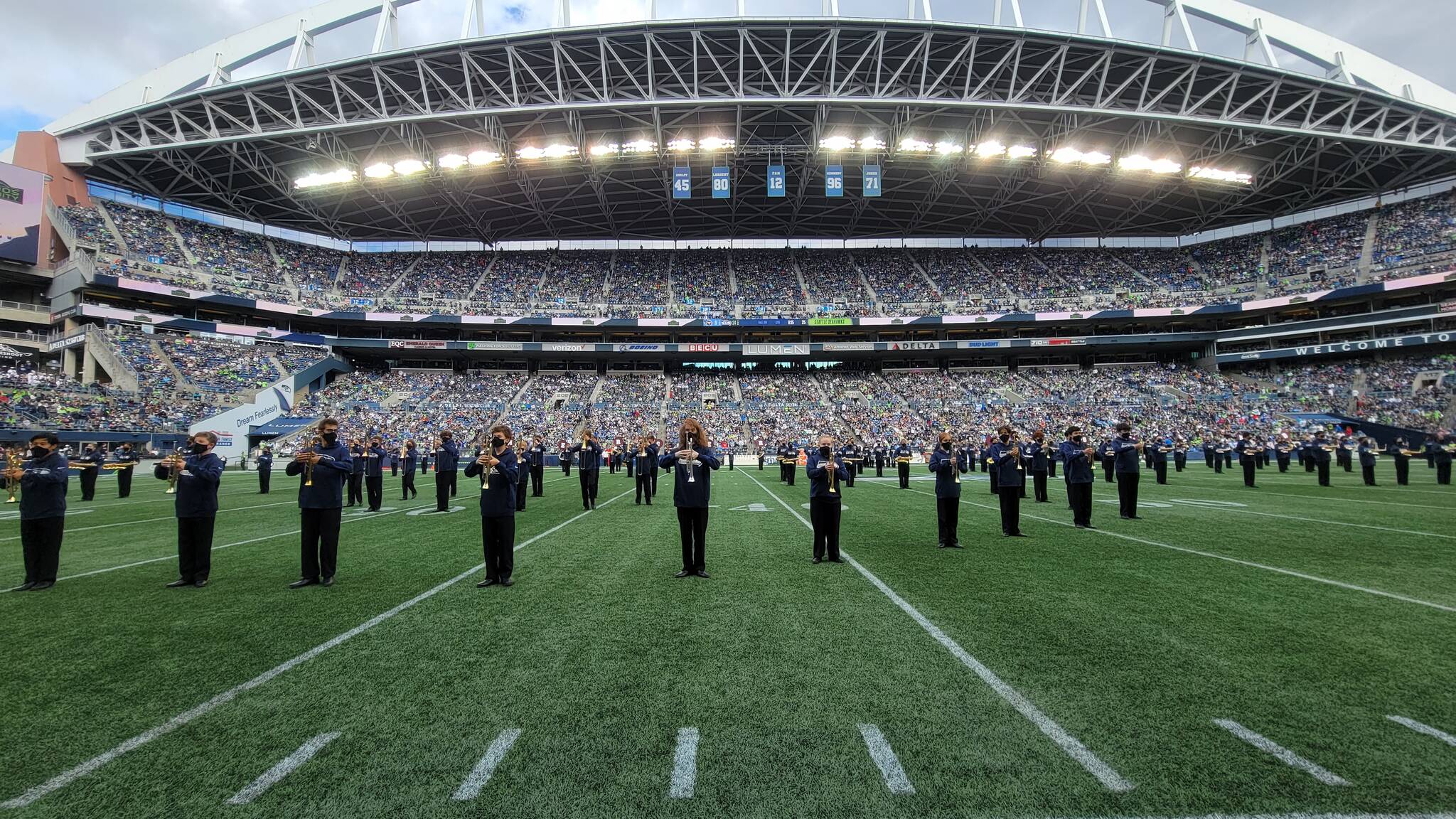 The Mercer Island High School marching band performed twice on Sept. 19 at the Seattle Seahawks’ regular season home opener versus the Tennessee Titans at Lumen Field. The Islanders first took the field for a special pregame concert featuring Seattle’s Macklemore and singer-guitarist Ayron Jones and provided visual support sans instruments. At halftime, the band played the CBS Sports/NFL theme. Tennessee beat the Seahawks, 33-30, in overtime. Photo courtesy of Joe Chen