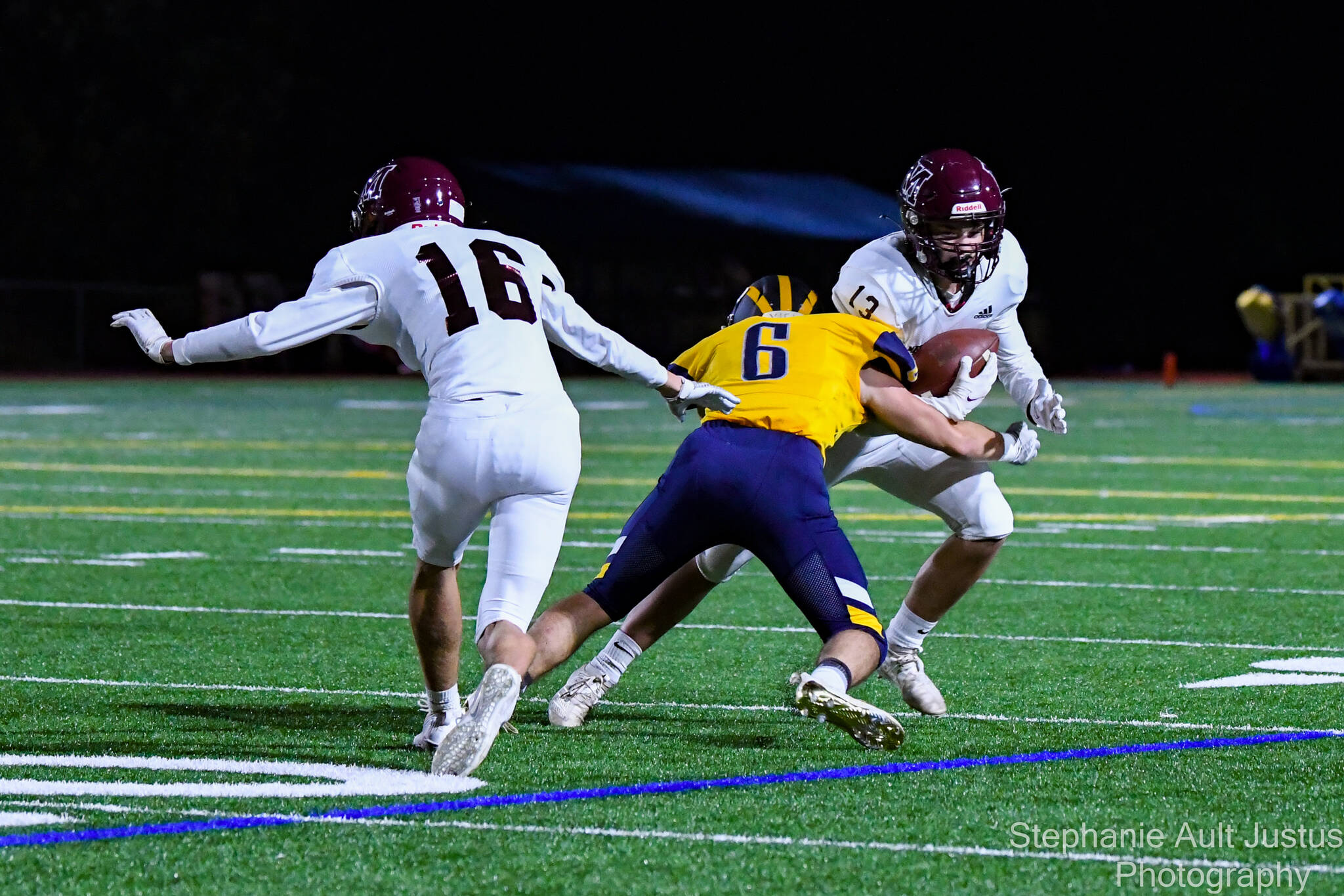 Bellevue’s Matt Yamamoto tackles Mercer Island’s Addison King while Mercer Island’s Davis Johnson enters the action during Bellevue’s 49-0 football victory on Oct. 1. MI quarterback Eli Fahey went 17-for-34 for 165 yards, including eight passes to Cole Drayton for 76 yards. Chase Shavey amassed eight solo tackles and seven assists for the Islanders (1-1 in 3A KingCo and 3-2 overall), who will next play at Liberty (Renton) at 7 p.m. on Oct. 8. Photo courtesy of Stephanie Ault Justus