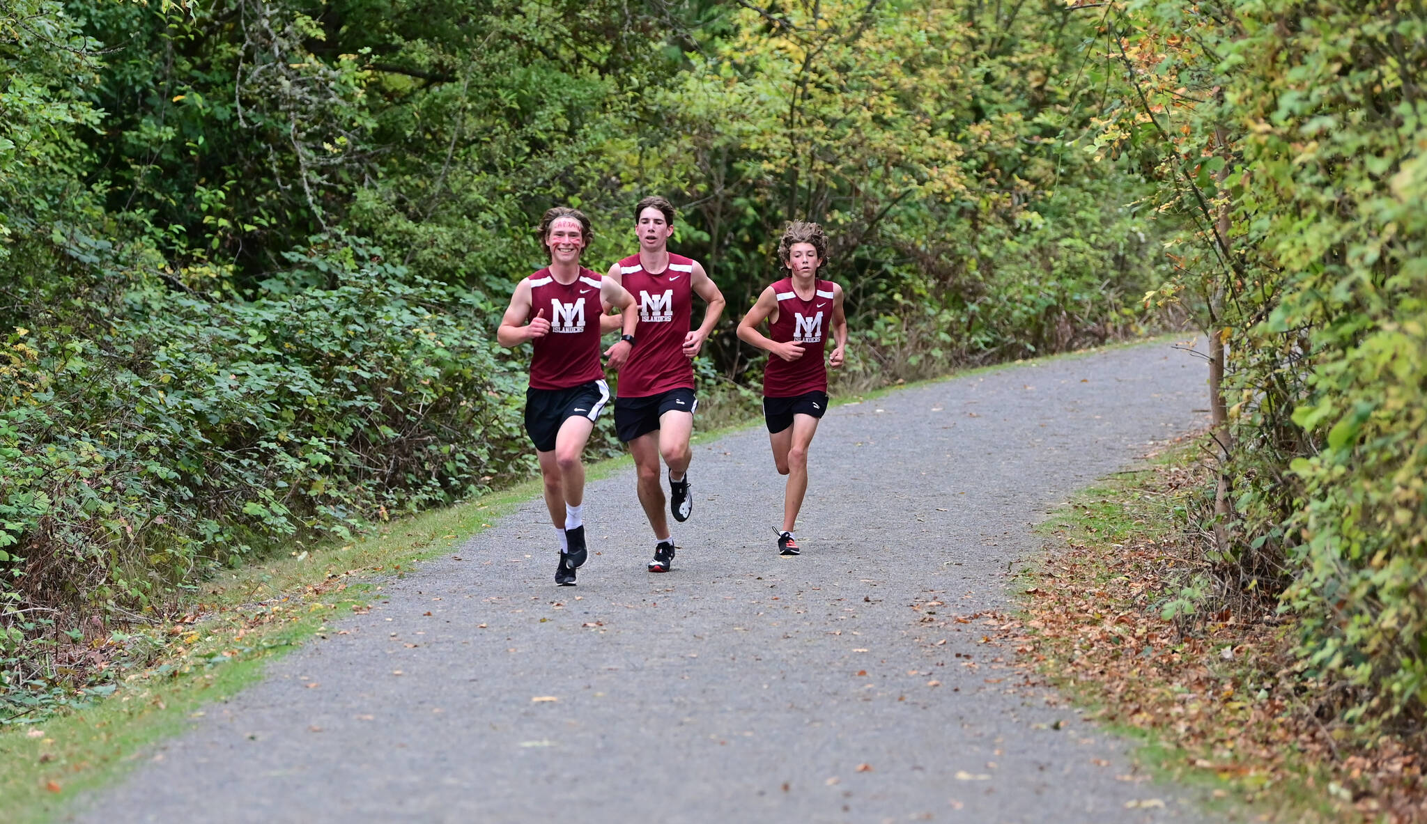 Mercer Island High School cross country runners, from left, Ryan Koopman, Kai Zettel and Owen Powell lead the way. Photo courtesy of Aaron Koopman