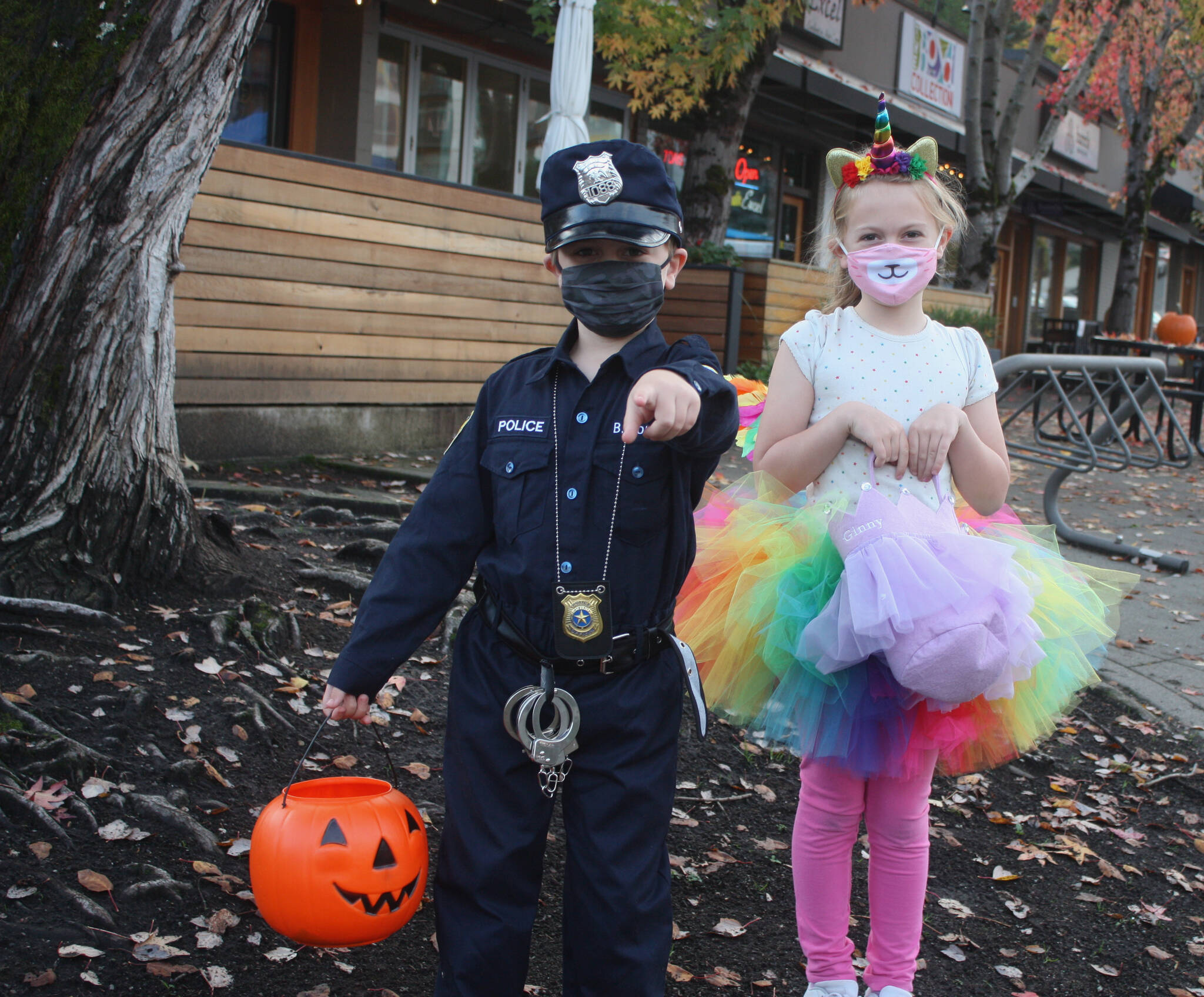 Baker and Ginny Rourke were two of the many costumed kids and parents who strolled through Town Center and visited participating businesses for some trick or treating fun on Oct. 29. The city of Mercer Island and the Mercer Island Chamber of Commerce coordinated the haunted event, which featured 30-plus businesses. Andy Nystrom/ staff photo