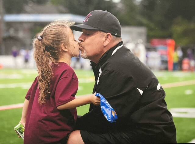 Former Mercer Island High School football head coach Ed Slezinger with his daughter, Savannah. Photo courtesy of Dave Wisenteiner