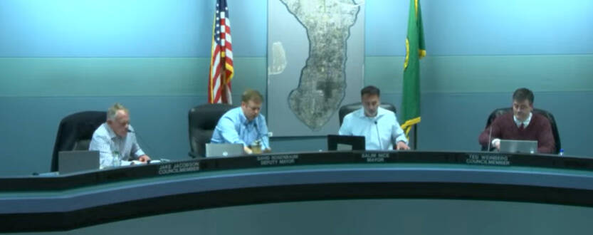 When the Mercer Island City Council’s March 15 meeting began, four members were sitting at the dais in the council chambers for the first time in two years due to the pandemic. In the hybrid meeting, pictured from left to right are Jake Jacobson, Deputy Mayor David Rosenbaum, Mayor Salim Nice and Ted Weinberg. Other councilmembers Wendy Weiker, Lisa Anderl and Craig Reynolds joined remotely along with staff members and consultants. Some residents addressed council during the appearances segment in person and remotely with their testimonies. The next council hybrid meeting will occur at 5 p.m. on April 5. “We will continue to use the hybrid technology for the foreseeable future,” said City Manager Jessi Bon during her March 15 report. Zoom screen shot