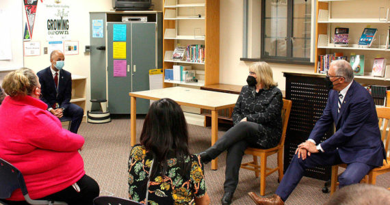 Gov. Jay Inslee and his wife, Trudi Inslee, listen to challenges faced by teachers on May 4 in Renton. (Cameron Sheppard/Sound Publishing)