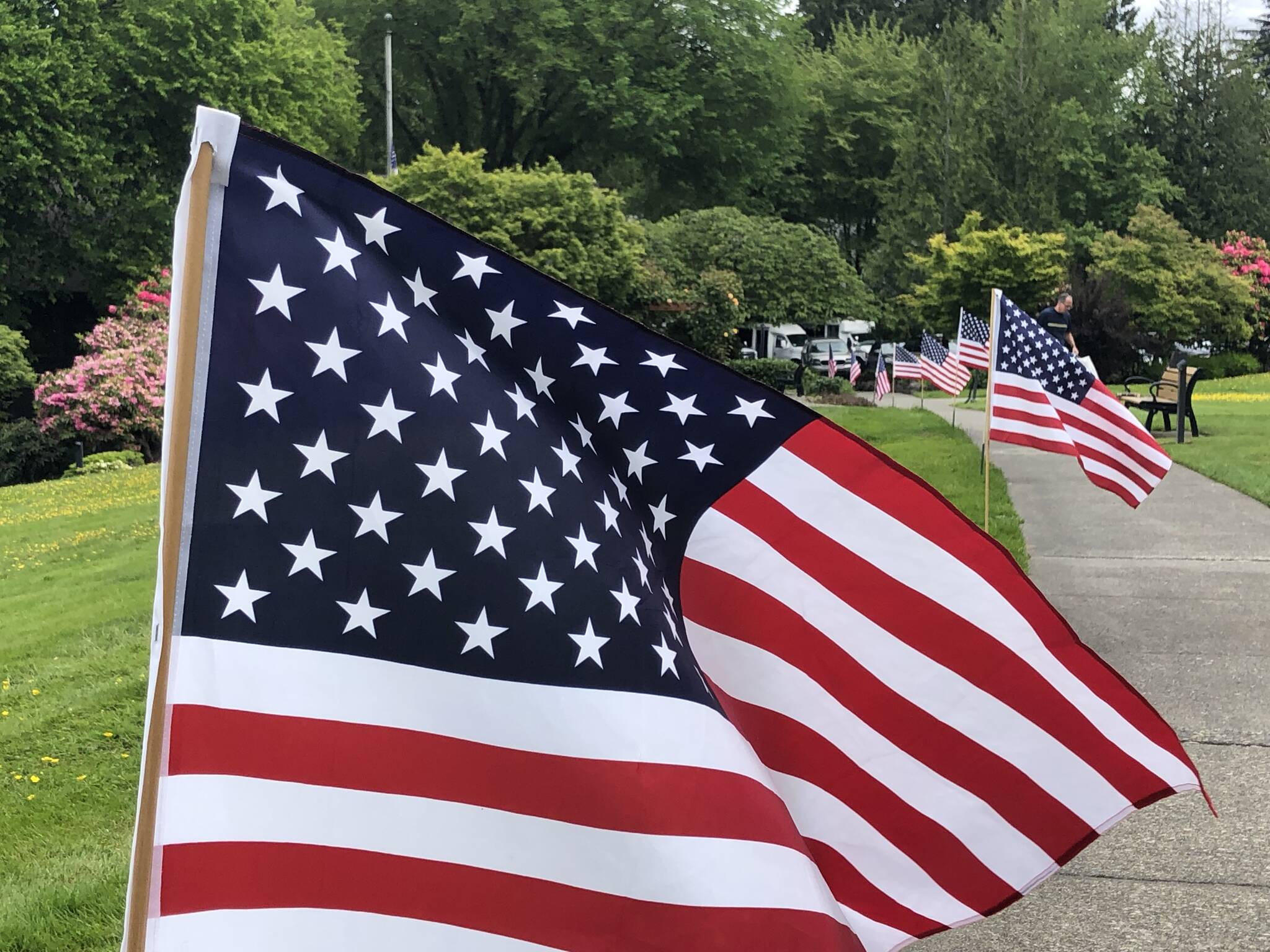 Covenant Living at the Shores on Mercer Island observes Memorial Day weekend each year by displaying several dozen flags throughout the campus. A team of residents plants the flags on driveways and walkways in honor of those who gave their lives to preserve the freedoms Americans enjoy. Courtesy of Greg Asimakoupoulos