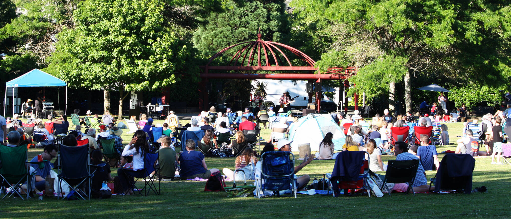 West Coast Feed entertains a large crowd at Mostly Music in the Park at Mercerdale Park on July 14. For more information on upcoming concerts, visit www.mercerisland.gov/mmip. Andy Nystrom/ staff photo