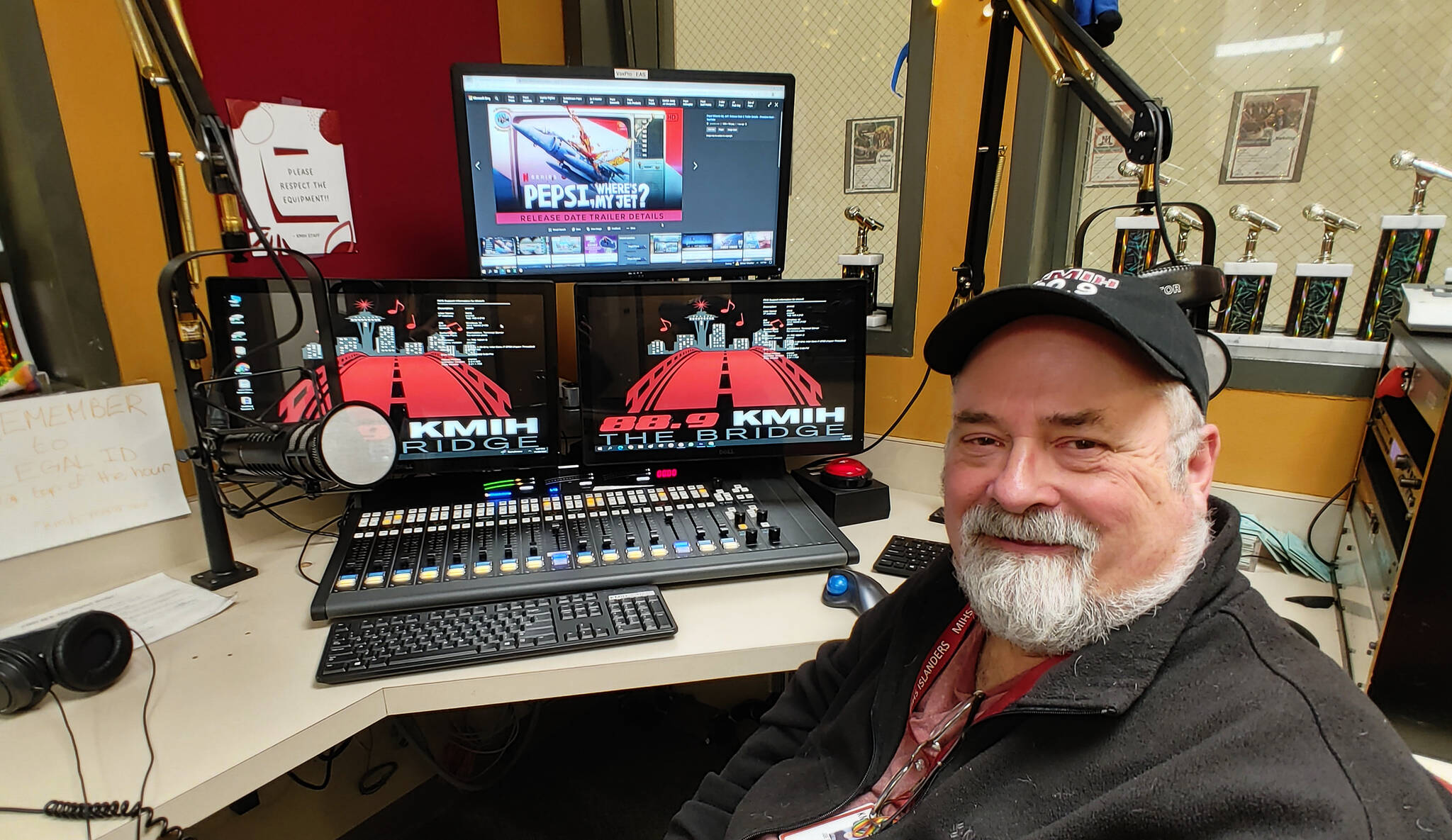 Joe Bryant sits in the broadcasting booth of Mercer Island High School’s KMIH 88.9 The Bridge. Andy Nystrom/ staff photo